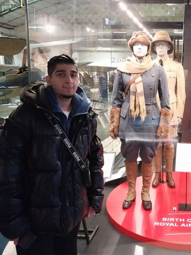 Male student next to old RAF uniform