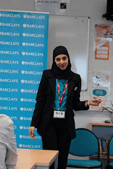Barclays employee presenting to students