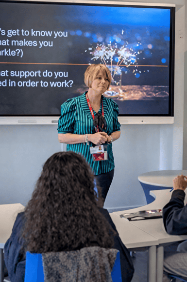 Ways Into Work employee presenting to students